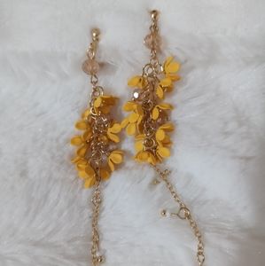 Yellow flower clip on earrings
